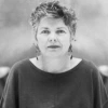 photo of Minnie Bruce Pratt in black and white with short wavy hair and a flowing shirt